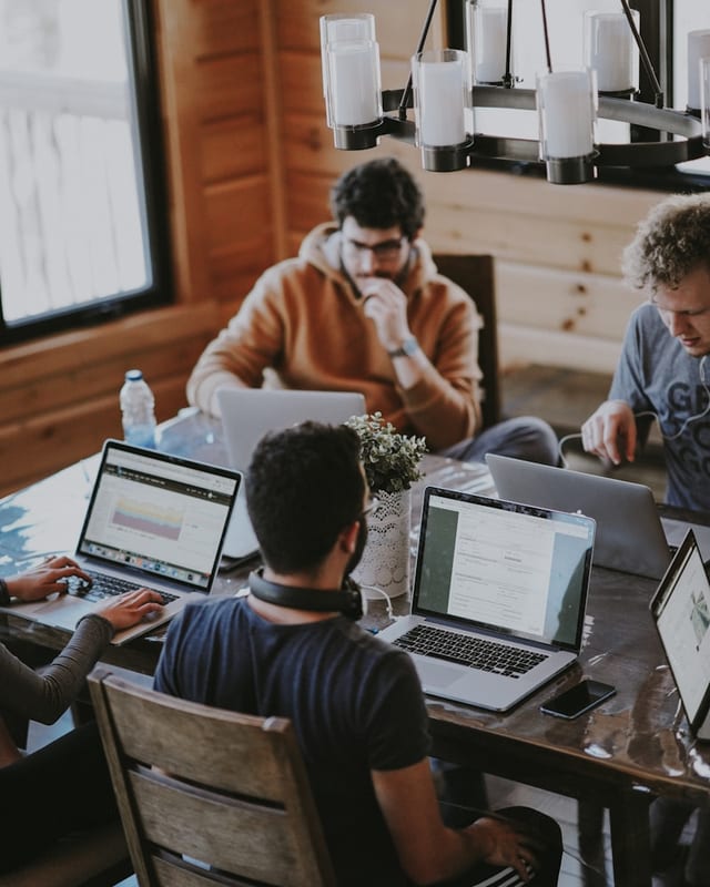 Business team collaborating around an office table